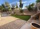 Outdoor patio with a small yard area and tiered fountain feature at 2947 Caxton Grove Dr, Henderson, NV 89052