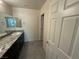 Modern bathroom with granite countertops and double sinks at 2947 Caxton Grove Dr, Henderson, NV 89052