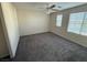 Spacious bedroom featuring carpeted floors and large windows at 2947 Caxton Grove Dr, Henderson, NV 89052