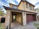 Attractive two-story home with stone accents, covered entryway, and attached garage at 2947 Caxton Grove Dr, Henderson, NV 89052
