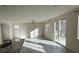 Open-concept living room with bright natural light and tile flooring throughout at 2947 Caxton Grove Dr, Henderson, NV 89052