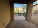 Cozy outdoor patio area featuring brick flooring and a view of the neighborhood at 2947 Caxton Grove Dr, Henderson, NV 89052