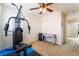 Gym equipment in a converted bedroom, bathed in natural light and featuring rubber flooring at 3088 Bicentennial Pkwy, Henderson, NV 89044