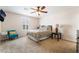 Comfortable bedroom with a ceiling fan, and a patterned bedspread at 3088 Bicentennial Pkwy, Henderson, NV 89044