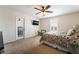 Relaxing bedroom showcasing a TV, shuttered window, and comfortable furnishings at 3088 Bicentennial Pkwy, Henderson, NV 89044