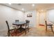 Cozy dining area with a modern table set, adjacent to kitchen, and access to the hallway at 3088 Bicentennial Pkwy, Henderson, NV 89044
