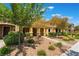 Charming townhome with neatly trimmed landscaping and a paved walkway at 3088 Bicentennial Pkwy, Henderson, NV 89044