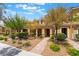 Inviting townhome with well-manicured landscaping, covered entrance, and a welcoming facade at 3088 Bicentennial Pkwy, Henderson, NV 89044