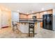 Bright kitchen features an island with bar seating and stainless steel appliances at 3088 Bicentennial Pkwy, Henderson, NV 89044