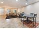 Bright living area with neutral decor, tiled floors, and an adjacent dining area, creating a versatile space at 3088 Bicentennial Pkwy, Henderson, NV 89044
