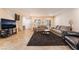 Cozy living room features ample seating, a large television, and easy access to the stairs at 3088 Bicentennial Pkwy, Henderson, NV 89044