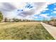 Expansive green space with a walking path on the edge and community buildings in the distance at 3088 Bicentennial Pkwy, Henderson, NV 89044
