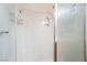 Bathroom features a textured glass shower stall with built in shelving, hooks and chrome fixtures at 3088 Bicentennial Pkwy, Henderson, NV 89044