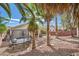 Backyard featuring mature landscaping, covered patio, and ample room for activities at 3257 River Glorious Ln, Las Vegas, NV 89135