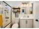 Bathroom featuring shower over bath and vanity with storage at 3257 River Glorious Ln, Las Vegas, NV 89135