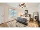 Bedroom featuring a large bed, dresser, and natural light at 3257 River Glorious Ln, Las Vegas, NV 89135