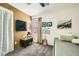 Cozy bedroom featuring carpeted floors, natural light, and decorative wall art at 3257 River Glorious Ln, Las Vegas, NV 89135