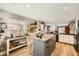 Open kitchen featuring an island, breakfast bar, and hardwood floors at 3257 River Glorious Ln, Las Vegas, NV 89135