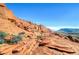 A beautiful view of the Red Rock mountain range against a bright blue sky at 3257 River Glorious Ln, Las Vegas, NV 89135