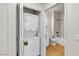 Bathroom with stacked washer and dryer; view of marble look tub/shower combination at 3318 N Decatur Blvd # 1043, Las Vegas, NV 89130
