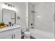 A modern bathroom with marble-look shower and tub combination and black matte hardware at 3318 N Decatur Blvd # 1043, Las Vegas, NV 89130