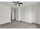 Bright bedroom with ceiling fan, neutral carpet, and closet at 3318 N Decatur Blvd # 1043, Las Vegas, NV 89130