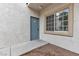 Exterior image of a condo showing the front door and large window at 3318 N Decatur Blvd # 1043, Las Vegas, NV 89130