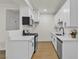 Updated kitchen with white cabinetry, stone counters and stainless appliances at 3318 N Decatur Blvd # 1043, Las Vegas, NV 89130