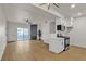 Open living room and kitchen with stainless steel appliances and fireplace at 3318 N Decatur Blvd # 1043, Las Vegas, NV 89130