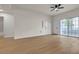 Bright living room with ceiling fan, wood floors and access to balcony at 3318 N Decatur Blvd # 1043, Las Vegas, NV 89130