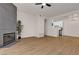 Spacious living room with hardwood floors, modern fireplace and ceiling fan at 3318 N Decatur Blvd # 1043, Las Vegas, NV 89130