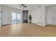 Living room featuring wood floors, modern fireplace, and access to balcony at 3318 N Decatur Blvd # 1043, Las Vegas, NV 89130