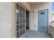 A private patio with neutral walls, sliding glass door and storage closet at 3318 N Decatur Blvd # 1043, Las Vegas, NV 89130
