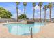 Enjoy the sparkling community pool with palm trees, a spa and lounge chairs at 3318 N Decatur Blvd # 1043, Las Vegas, NV 89130