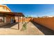 Large backyard featuring a patio, firepit, and privacy fence at 3432 Beca Faith Dr, North Las Vegas, NV 89032