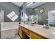 Double sink bathroom featuring a bathtub and tiled floors at 3432 Beca Faith Dr, North Las Vegas, NV 89032
