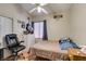 Cozy bedroom featuring a ceiling fan and a large window at 3432 Beca Faith Dr, North Las Vegas, NV 89032
