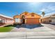 Charming, two-story home features a spacious two-car garage and inviting front yard with vibrant landscaping at 3432 Beca Faith Dr, North Las Vegas, NV 89032