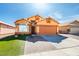 Charming, two-story home features a spacious two-car garage and inviting front yard with vibrant landscaping at 3432 Beca Faith Dr, North Las Vegas, NV 89032