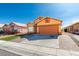 Charming, two-story home features a spacious two-car garage and inviting front yard with vibrant landscaping at 3432 Beca Faith Dr, North Las Vegas, NV 89032