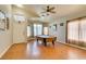 A spacious game room features an elegant pool table, ceiling fan, and gleaming wood floors at 3432 Beca Faith Dr, North Las Vegas, NV 89032