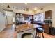 Well-equipped kitchen with stainless steel appliances, granite countertops, and an island with barstool seating at 3432 Beca Faith Dr, North Las Vegas, NV 89032