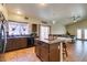 Open concept kitchen features an island, tile floors, and lots of natural light at 3432 Beca Faith Dr, North Las Vegas, NV 89032