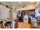 Functional kitchen equipped with modern appliances, granite countertops, ample storage, and a central island at 3432 Beca Faith Dr, North Las Vegas, NV 89032