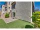 Backyard with artificial grass, paver patio, and stucco wall providing a private outdoor space at 345 Gracious Way, Henderson, NV 89011