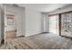 Bedroom featuring neutral walls, soft carpet, and sliding doors with access to a balcony at 345 Gracious Way, Henderson, NV 89011