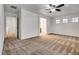 Spacious bedroom featuring plush carpeting, ample natural light from windows, and easy access to other rooms at 345 Gracious Way, Henderson, NV 89011
