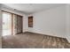 Bright bedroom with sliding door access to the outdoors and plush neutral carpeting at 345 Gracious Way, Henderson, NV 89011