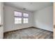 Bedroom with two windows bringing in natural light and plush carpeting at 345 Gracious Way, Henderson, NV 89011
