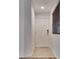 Bright entryway featuring a white front door, neutral tile flooring, and a modern security system at 345 Gracious Way, Henderson, NV 89011